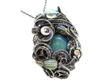 Load image into Gallery viewer, Color-Changing "Mood" Steampunk Pendant in Sterling Silver with UV-Reactive Glass