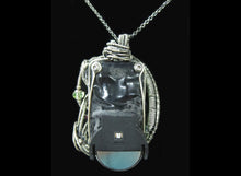 Load image into Gallery viewer, Uranium Glass Pendant with Upcycled Electronic and Watch Parts, Steampunk/Cyberpunk Fusion UV LED