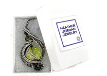 Load image into Gallery viewer, UV-Reactive Glass Pendant in Sterling Silver with Watch Gear: Steampunk Jewelry