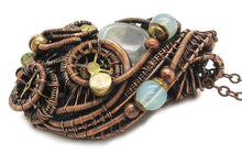 Load image into Gallery viewer, Liquid Steampunk Glow-In-The-Dark Pendant: Bronze Wire-Wrapped Necklace with UV-Fluorescent Glass