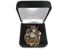 Load image into Gallery viewer, Liquid Steampunk Glow-In-The-Dark Pendant: Bronze Wire-Wrapped Necklace with UV-Fluorescent Glass