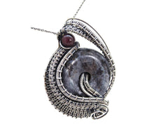 Load image into Gallery viewer, Larvikite Wire-Wrapped Pendant in Sterling Silver with Garnet; &quot;Woven Donut&quot;